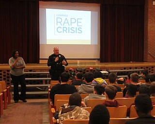 Neighbors | Jessica Harker .Officer Phil Merlo introduced Dawn Powell from Compass Family March 26 to Glenwood Junior High School students for the school's first Cyber Safety presentation event.