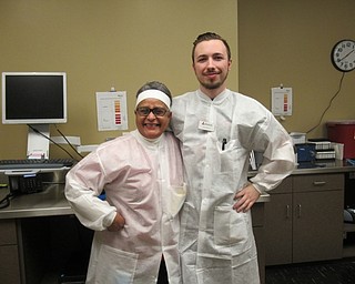 Neighbors | Jessica Harker.Biotest employees Candi Mantilla and Brandon Farr work with donors to collect and safely transport plasma.