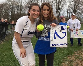 Neighbors | Submitted.Poland High School sophomore softball player Cam Lattanzio was supported by her Little Dog Olivia at the Poland versus Niles game, which Poland won 11-1 in six innings.