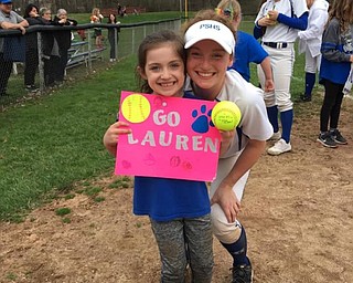 Neighbors | Submitted.Poland High School senior softball player Lauren Sienkiwicz celebrated the team’s win over Niles with her Little Dog Caroline.
