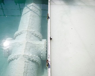 Water in the sedimentation basins before it's clarified (right) and after (left) at the Aqua Ohio water plant in Poland. The sedimentation basins will be replaced by a new solid contact unit. EMILY MATTHEWS | THE VINDICATOR