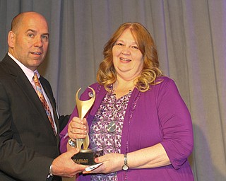 William D. Lewis The Vindicator   JAmes Dignan President and CEO of Regional Chamber, presents 2019 Athena award to Dr. Tammy King during 5-16-19 event t Mr.Anthony's