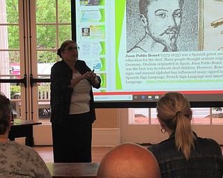 Neighbors | Jessica Harker.Presenter Irene Tunanidas spoke in sign language as librarian Karen Steed translated for hearing community members gathered at the Poland library May 10 for her presentation on deaf history.