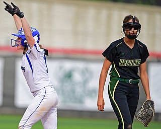 YOUNGSTOWN, OHIO - MAY 16, 2019: Poland's Lauren Sienkiewicz celebrates after hitting a 2-RBI double as Ursuline's Destiny Goodnight watches in the fourth inning of Thursday afternoons OHSAA Tournament game at Youngstown State University. Poland won 7-6. DAVID DERMER | THE VINDICATOR