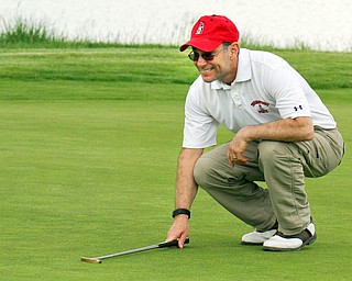 William D. Lewis The vindicator John Hazy lines up a putt at Firestone Farms during GGOV action 5-17-19.