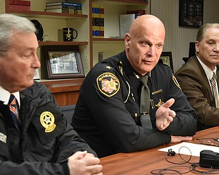 From left, James Ciotti of the state Bureau of Criminal Investigation; Mahoning County Sheriff Jerry Greene; Austintown police Chief Bob Gavalier and Mahoning County assistant Prosecutor Steve Yacovone, discuss Friday the arrest of 16 men in an internet sex sting. The men were arrested throughout the week at a location in Mahoning County after they made arrangements over the internet to meet someone they thought was a teen.
