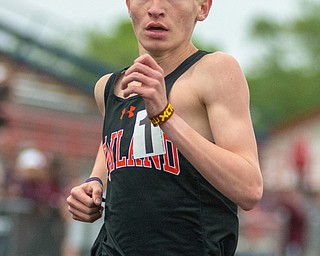 Vinny Mauri of Howland cruises toward a victory in the 3,200-meter run in the Division I District Track and Field Meet at Greenwood Chevrolet Falcon Stadium on Friday night.