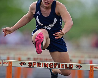 NEW SPRINGFIELD, OHIO - MAY 17, 2019: McDonald's Naomi Domitrovich clears a hurdle during the girls 100 meter hurdles, Friday night during the Division III District Track Meet at Springfield High School. DAVID DERMER | THE VINDICATOR