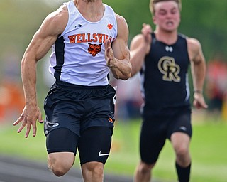 NEW SPRINGFIELD, OHIO - MAY 17, 2019: Wellsville's Justin Wright races ahead of Crestview's Ethan Powell during the boys 100 meter dash, Friday night during the Division III District Track Meet at Springfield High School. DAVID DERMER | THE VINDICATOR