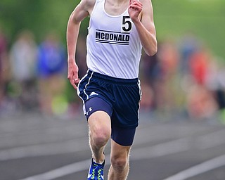 NEW SPRINGFIELD, OHIO - MAY 17, 2019: McDonald's Brody Rupe crosses the finish line during the boys 1600 meter run, Friday night during the Division III District Track Meet at Springfield High School. DAVID DERMER | THE VINDICATOR