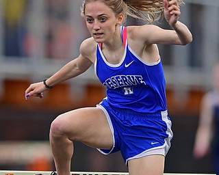 NEW SPRINGFIELD, OHIO - MAY 17, 2019: Western Reserve's Maddy Owen clears a hurdle during the girls 300 meter hurdles, Friday night during the Division III District Track Meet at Springfield High School. DAVID DERMER | THE VINDICATOR