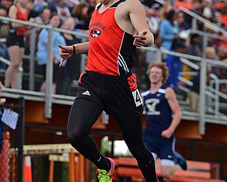 NEW SPRINGFIELD, OHIO - MAY 17, 2019: Springfield's Garrett Walker crosses the finish line to win the boys 400 meter dash, Friday night during the Division III District Track Meet at Springfield High School. DAVID DERMER | THE VINDICATOR