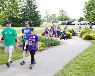 Chrissy Falleti, right, who has cystic fibrosis, walks with her husband Joe Falleti, left, and her cousin Nick Novosel, all of Liberty, in the 20th annual Mahoning/Trumbull Great Strides cystic fibrosis walk at Boardman Park on Sunday afternoon. EMILY MATTHEWS | THE VINDICATOR