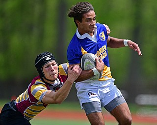 AVON LAKE, OHIO - MAY 19, 2019: Youngstown East's Timmy Bowser runs away from an Avon Lake defender and in for a score during the first half of their game, Sunday afternoon at Avon Lake High School. DAVID DERMER | THE VINDICATOR