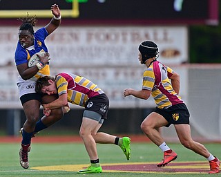 AVON LAKE, OHIO - MAY 19, 2019: Youngstown East's Dmarcus Carr attempts to fight off an Avon Lake defender during the first half of their game, Sunday afternoon at Avon Lake High School. DAVID DERMER | THE VINDICATOR