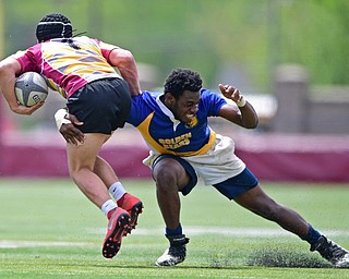 AVON LAKE, OHIO - MAY 19, 2019: Youngstown East's XXXX tackles a Avon Lake ball carrier during the second half of their game, Sunday afternoon at Avon Lake High School. DAVID DERMER | THE VINDICATOR