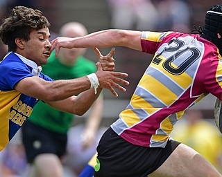 AVON LAKE, OHIO - MAY 19, 2019: Youngstown East's Timmy Bowser attempts to reach for a Avon Lake ball carrier during the second half of their game, Sunday afternoon at Avon Lake High School. DAVID DERMER | THE VINDICATOR