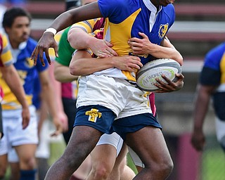 AVON LAKE, OHIO - MAY 19, 2019: Youngstown East's XXXX runs the ball while being hit by an Avon Lake defender during the second half of their game, Sunday afternoon at Avon Lake High School. DAVID DERMER | THE VINDICATOR