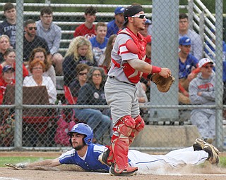William D. Lewis the vindictor Poland's Braden Olsen(22)scores during irst inning of 5-21-19 win over Niles at Cene. Waiting for the throw is Niles catcher Nick Guarieri(7)