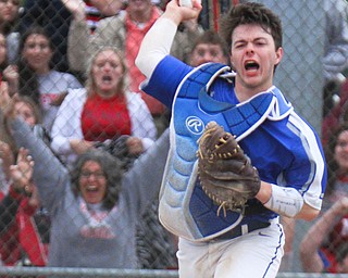 William D. Lewis The Vindictor Poland's catcher MJ Farber(25)  reacts during game ending play. Poland won 8-7.