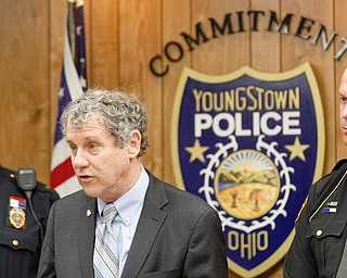 From left, Youngstown police Chief Robin Lees, U.S. Sen. Sherrod Brown, D-Ohio, and Mahoning County Sheriff Jerry Greene on Monday discuss a bill Brown is sponsoring that would help provide equipment to police to safely detect synthetic opioids.