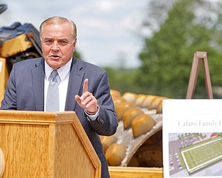 Anthony Cafaro, retired CEO and president of the Cafaro Co., speaks during a ground-breaking ceremony for the $2.5 million Cafaro Family Field on Elm Street Monday afternoon. The field will be used for intramural and club sports.
