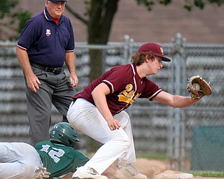 William D. Lewis The vindicator Canton's Chris Wilson(12) dives back to the bag as South Range's Mike Perry(11) tries for  the out during 5-22-19 action at Cene.