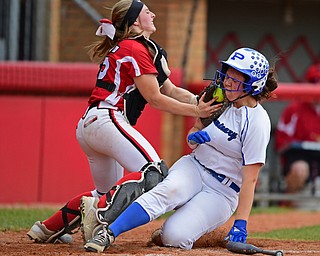 AKRON, OHIO - MAY 22, 2019: Poland's Ally Nittoli is tagged out at home by Field's Sarah Snyder trying to score in the second inning of their OHSAA Tournament game, Wednesday night at Firestone Stadium. Poland won 6-5. DAVID DERMER | THE VINDICATOR