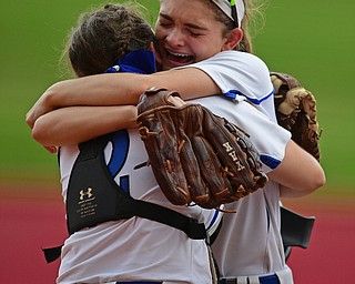 AKRON, OHIO - MAY 22, 2019: Poland's Brooke, right, hugs Camryn Lattanzio after the final out to defeat Field 6-5 in their OHSAA Tournament game, Wednesday night at Firestone Stadium. Poland won 6-5. DAVID DERMER | THE VINDICATOR