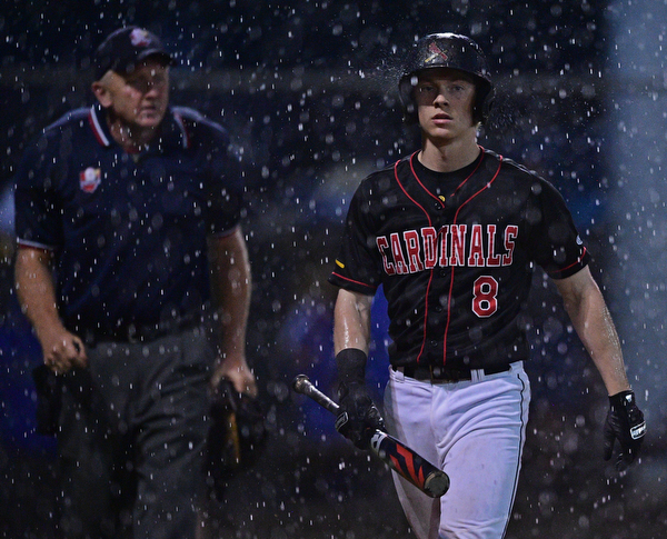 STRUTHERS, OHIO - MAY 22, 2019: Canfield's Dom Pilolli walks to the dugout after the start of a rain delay in the third inning of their OHSAA Tournament game, Wednesday night at Cene Park. DAVID DERMER | THE VINDICATOR