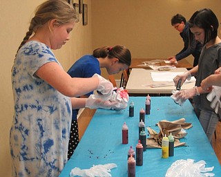 Neighbors | Jessica Harker.Children used tie dye to decorate pillow cases using design instuctions and materials provided by the Poland library April 9.