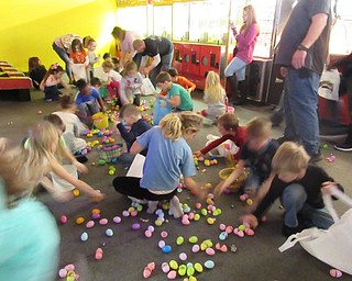 Neighbors | Jessica Harker .Children raced to gather eggs into their baskets April 20 at Austintown Bounce where First American Loans sponsored the annual egg hunt.