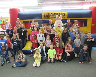 Neighbors | Jessica Harker .Community members posed with the Easter Bunny at Austintown Bounce April 20 for the annual Easter Extraviganza event sponsored by First American Loans.