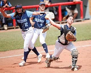 Hillsdale's Emma Fowler, right, throws the ball to first with Olivia Betson, left, and Emily Crossen behind her during their game against Bristol at Firestone Stadium in Akron on Thursday. EMILY MATTHEWS | THE VINDICATOR
