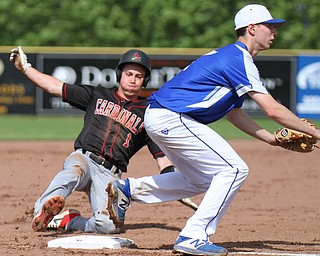 William D. Lewis The Vindicator  Canfield's Chance Merlin(1) slides safely into 3rd as Poland'sStephen Carney(17) waits for the throw.