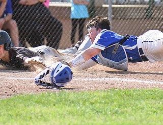 William D. Lewis The Vindicator  Canfield;'s Brayden Beck(9) scores as Poland catcher MJ Farber(25) tries to make the tag durig 5-23-19 action at Cene.