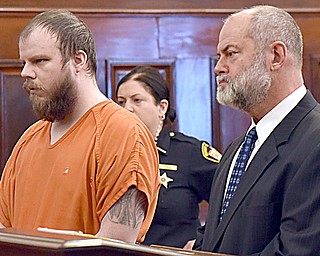 Marc Flora, left, and his attorney Doug Taylor listen in Mahoning County Common Pleas Court just before Flora was sentenced Thursday to 30 years to life in prison after admitting he stabbed his 1-year-old daughter to death in August in their Campbell home. 