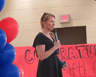 Neighbors | Jessica Harker .Austintown Intermediate School principal Angel Owens addressed fifth-grade students at their farewell ceremony on May 14.