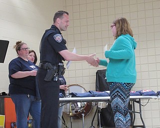 Neighbors | Jessica Harker .Officer David Potkonicki gifted fifth-grade students with their DARE graduation certificates at the annual fifth-grade farewell ceremony.