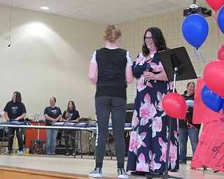 Neighbors | Jessica Harker .Fifth-grade teachers at Austintown Intermediate School handed out graduation certificates to students on May 14 at the school's fifth-grade farewell ceremony.