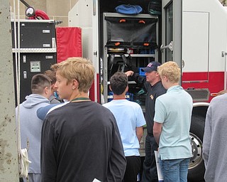 Neighbors | Jessica Harker.Canfield Fire Department representatives showed middle school students the inner workings of the fire engine May 13 during the school's annual Career Day.