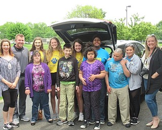 Neighbors | Jessica Harker.Leonard Kirtz students and Poland Interact Club members posed outside of the school May 17 for the Poland student's book donation.
