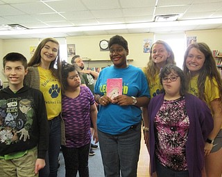 Neighbors | Jessica Harker.Poland Interact Club members and Leonard Kirtz students posed with the books donated by the Poland school community to be donated to the school May 17.