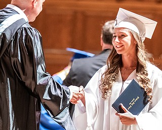 DIANNA OATRIDGE | THE VINDICATOR  Aspen Bell shakes the hand of Superintendent Raymond Soloman after receiving her diploma at the Class of 2019 Hubbard High School Commencement ceremony held at Stambaugh Auditorium on Wednesday night.