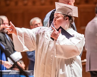 DIANNA OATRIDGE | THE VINDICATOR  Megan Ann Freeze gestures with pride after receiving her diploma at the Class of 2019 Hubbard High School Commencement ceremony held at Stambaugh Auditorium on Wednesday night.