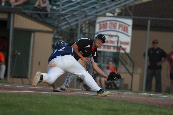 Shane Eynon of Springfield gets ready to tag out Alex Hernandez (12) of Warren JFK as he attempted to slide into home during the district championship matchup at Cene Park in Struthers on Thursday night.   Dustin Livesay  |  The Vindicator  5/23/19  Cene Park.