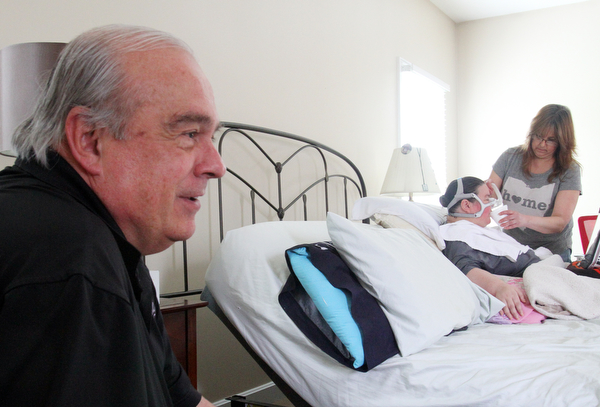 William D. Lewis The Vindicator Ron Moschella, longtime area girls basketball coach, spends time with his daughter Christine Terlesky who has ALS.