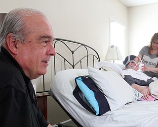 William D. Lewis The Vindicator Ron Moschella, longtime area girls basketball coach, spends time with his daughter Christine Terlesky who has ALS.
