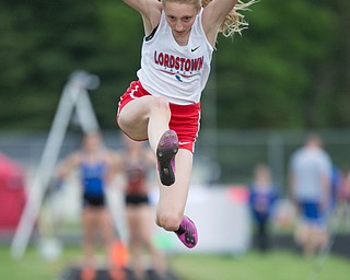 Lordstown's Sarah Schneider competes in the girls' long jump during the Division III regional track meet at Massillon Perry High School on Friday. EMILY MATTHEWS | THE VINDICATOR