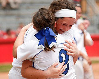 Poland's Ally Nittoli and Camryn Lattanzio (2) hug after beating Crestwood to win the Division II regional finals at Firestone Stadium in Akron on Saturday. EMILY MATTHEWS | THE VINDICATOR